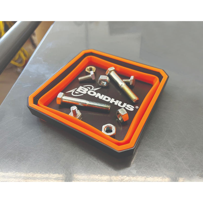 Bondhus metal hardware kit with silver bolts, nuts, and washers displayed inside a black and orange plastic tray on a gray metal surface.