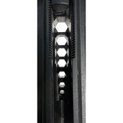 Close-up of a black textured plastic or metal component with a repeating hexagonal cutout pattern, shown vertically against a plain white background.