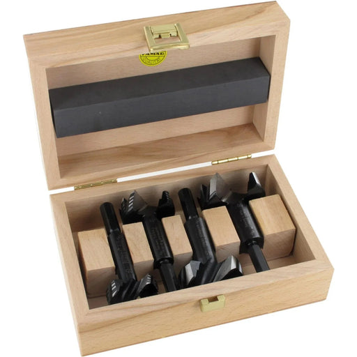 Set of 4 black forstner bits in a wooden box on a white background