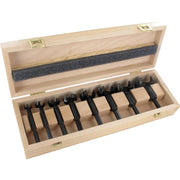 Set of 8 black forstner bits in a wooden box on a white background