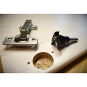 reverse of cupboiard door with hole prepared to insert the hinge